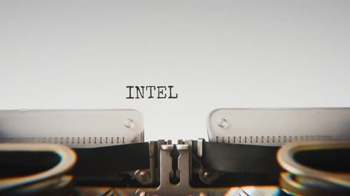 Old mechanical typewriter typing Intelligent Agent in a close-up view.