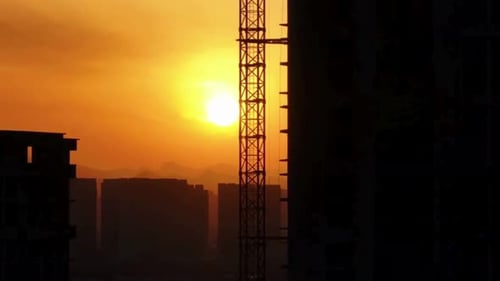 Cinematic And Majestic View Of Buildings Construction With Cranes