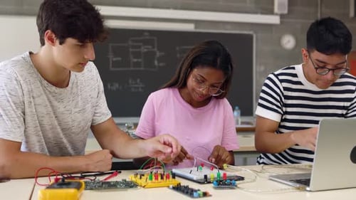 Group of Diverse Teenage Students Learning Together at Technology Class