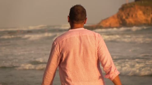 Young Man Walking Near Sea on Beach, Super 240