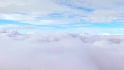 Peaceful Aerial View Drifting Over Dense White Clouds