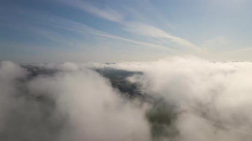 Top View From Above of Landscape Covered with Puffy Morning Fog Cold Humid Air Condensing in Rain