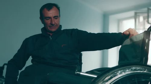 A Disabled Man Assembles a Stroller