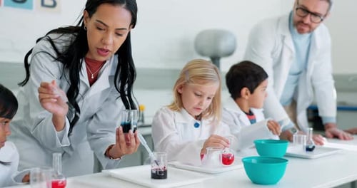 Children Conduct Science Experiment in School Classroom