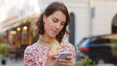 Young Woman Using Credit Bank Card Smartphone While Transferring Money Purchases Online Shopping