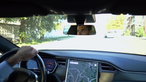 Eyes of Male Driver Reflecting of Rearview Mirror During Riding Electrical Auto Confident Man