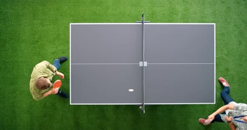 Young Adults Collaborating Around Ping Pong Table