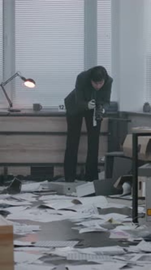 Woman Photographs Crime Scene in Messy Office