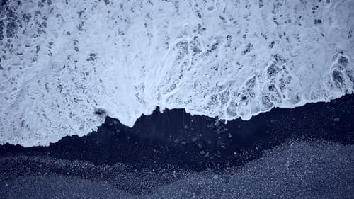 Oceans meet shore with captivating waves at a rocky beach
