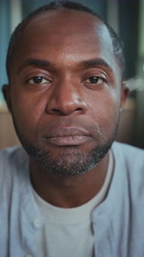 Contemplative Male Face in Soft Light Setting Expressive Portrait of Man Showing Resilience and