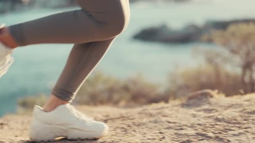 Fitness running, woman athlete feet and mountain exercise doing sport on a outdoor run