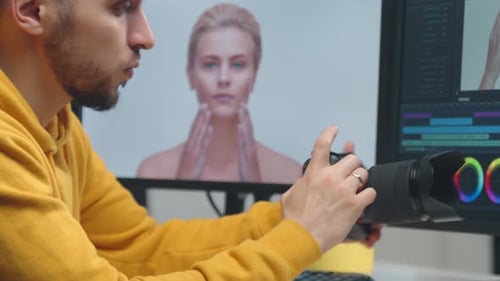 Freelance Videographer Colorist Editing Footage Using Professional Software Monitor and Montage