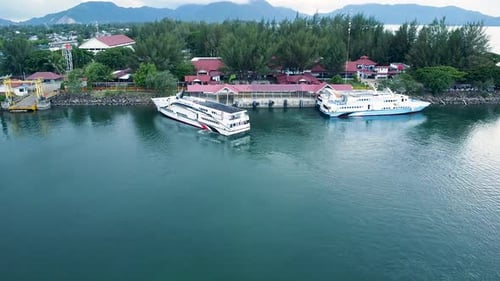 Passenger Ferries Docked at a Tropical Island Harbor