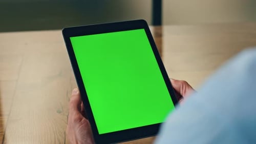 Man Holding Tablet with Chroma Key Screen