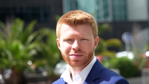 Close-Up of Smiling Man in Blue Blazer