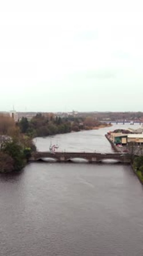 Slow advancing social ratio ratio vertical aerial video of the River Bann in Coleraine, Northern Ire