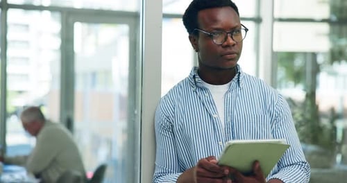 Business, man and reading with tablet in office for research, proofreading and update draft