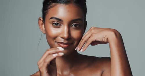Face, makeup and skincare of Indian woman in studio isolated on gray background