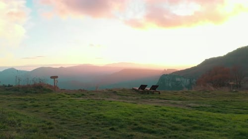 Drone Shot of Woman Lay in Steaming Wooden Hot Tub