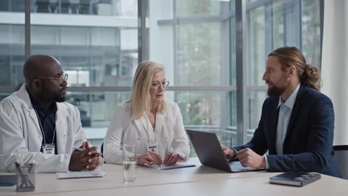 Medical Professionals Collaborating in Modern Office Setting
