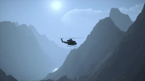 A Helicopter is Flying Over a Mountain Range