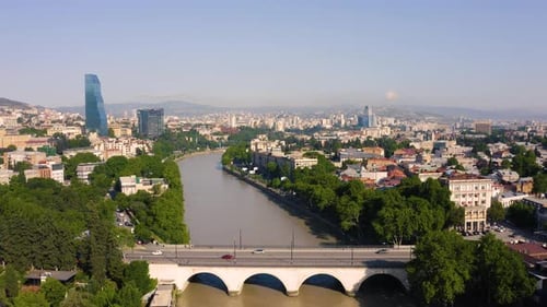 Aerial View of a Modern City Over a River