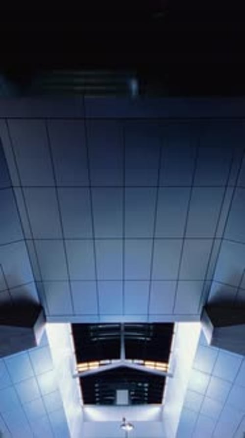 Station Ceiling View with Modern Grid Panels and Skylight at Amsterdam Noord Zuidlijn Metro