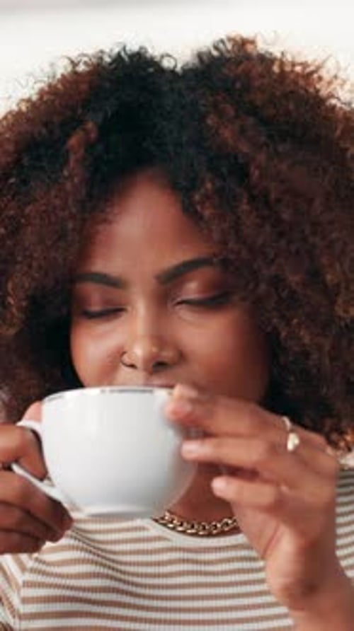 Woman Drinks Tea From A White Cup
