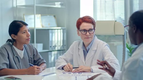 Group of Doctors Having Consilium in Medical Office