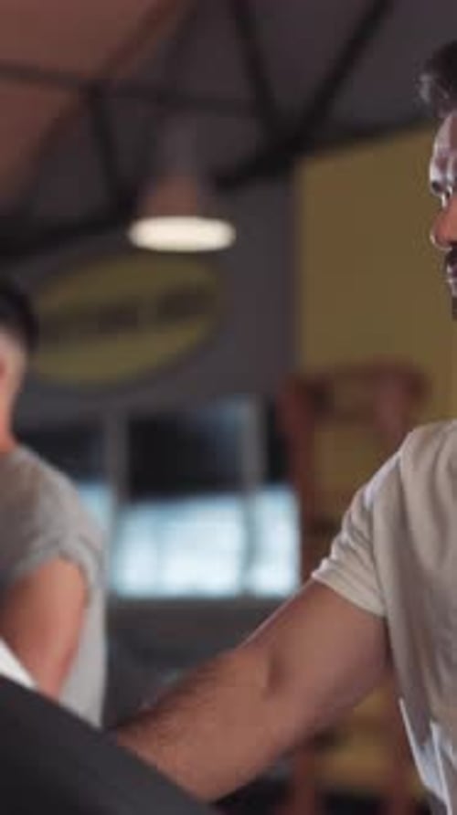 A Fitness Enthusiast Embracing Casual Wear While Engaging at Their Local Gym Facility