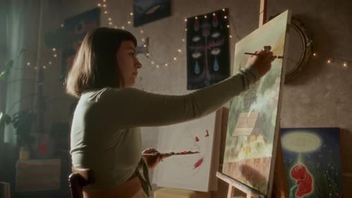 Woman Painting a Landscape in Artistic Home Studio