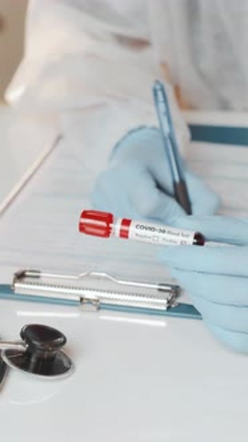 Doctor Administers Covid20 Blood Test With Care in Clinic