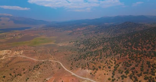 Huge dry valley among the lake and mountains. Impressive scenery of dry landscape