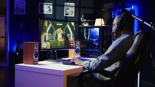 Man Playing Video Game at Home at Night