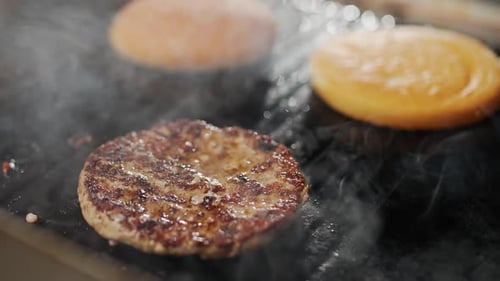Street Food the Process of Cooking a Burger on the Grill Meat and Bun are Fried on the Grill Burger