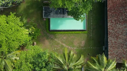 Top View Of Swimming Pool And Garden Of Accommodation In Sri Lanka. - aerial descend