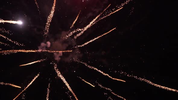 Fireworks explode sending sparks in every direction with different ...