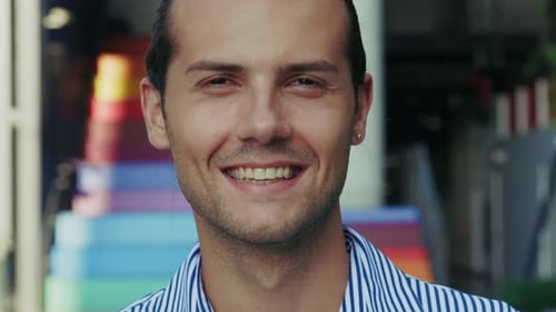 Close Up Portrait of a Happy Young Business Guy and Professional Career Maker Standing Outside in an
