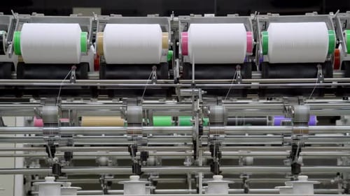 Texture manufacturing factory yarn processing large spools of yarn winding texturizing
