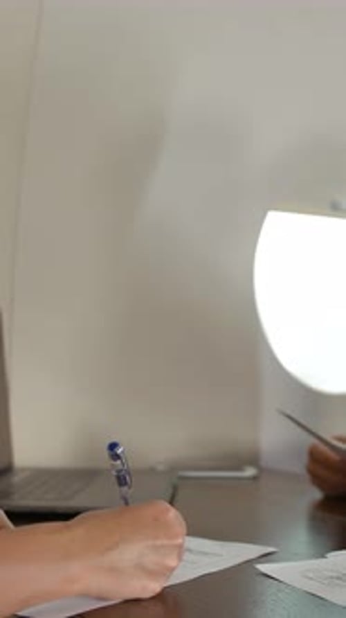 Businessman Reviewing and Signing Documents on Private Jet