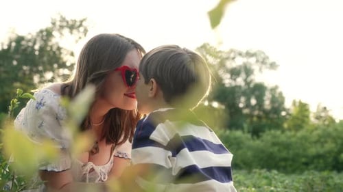 Woman and Child Spending Time Outdoors Together