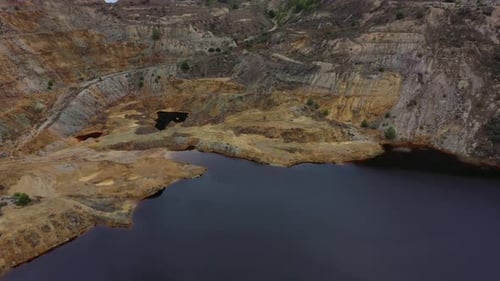 Aerial view of La Union Mining Park and ocher-tinted water lake.