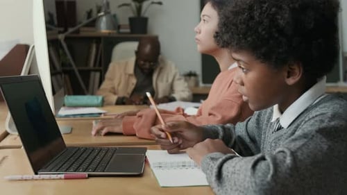 Children Studying Using Laptop and Computer in Modern School