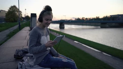 Portrait of Happy, Teenage Girl with Tablet Computer Near the River In