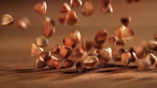 Buckwheat Falls on a Wooden Table Filmed on a Highspeed Camera at 1000 Fps
