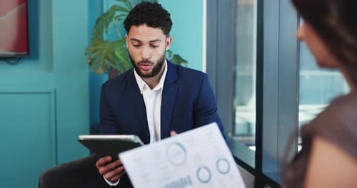 Business Meeting: Man Explains Data to Colleague