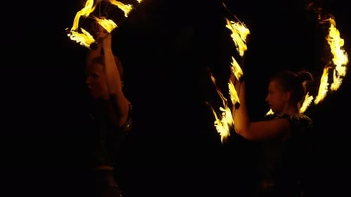 Women Performing Exciting Fire Dance at Night
