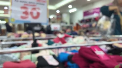 Defocused footage of clothing in a department store