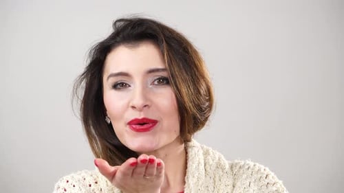 Woman Blowing a Kiss to the Camera