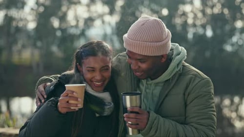 Affectionate Couple Enjoying Hot Drinks Outdoors